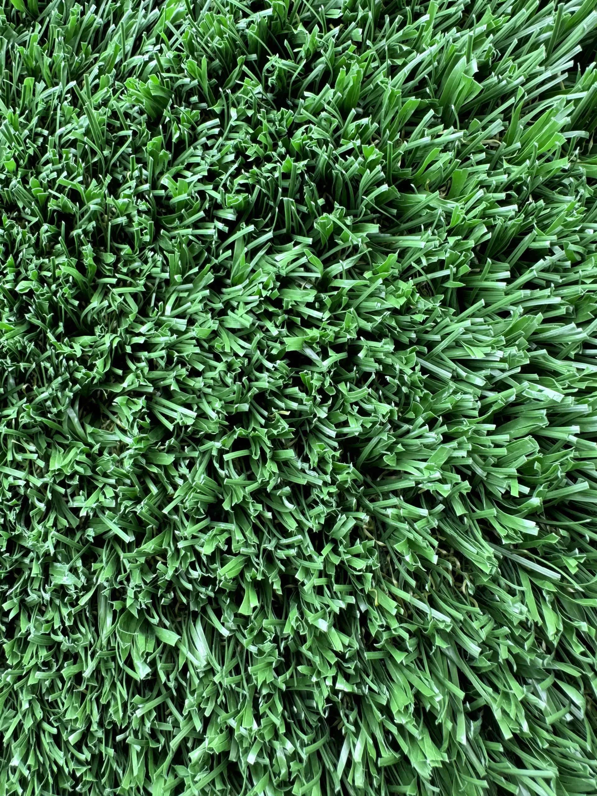 A close up, overhead view of bright green artificial turf.