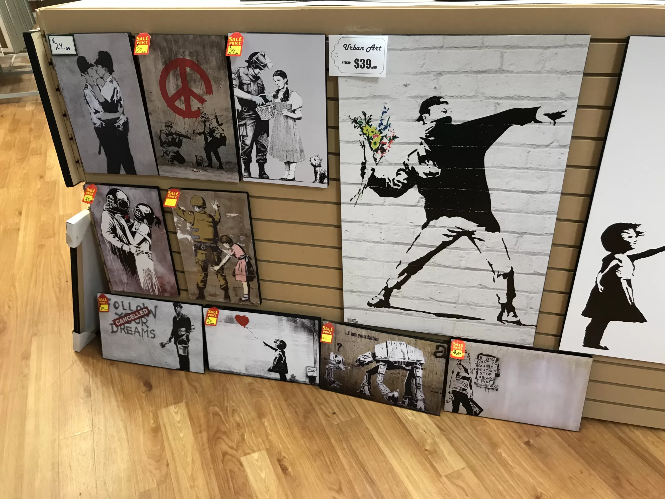 A collection of Banksy art reproductions for sale.