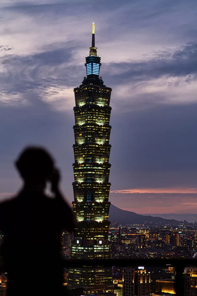 Taipei 101 Vertical Photo at night with spectator