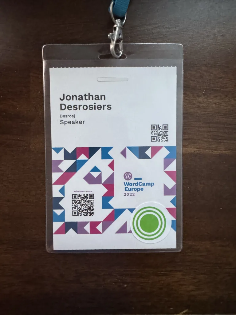 My WordCamp Europe 2022 speaker badge consisting of an event branded badge with my name printed on.
