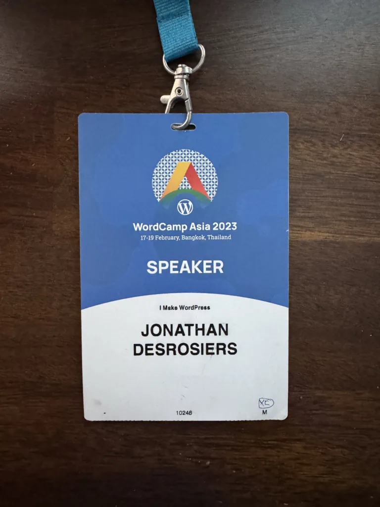 My WordCamp Asia 2023 speaker badge consisting of an event branded badge with my name printed on.